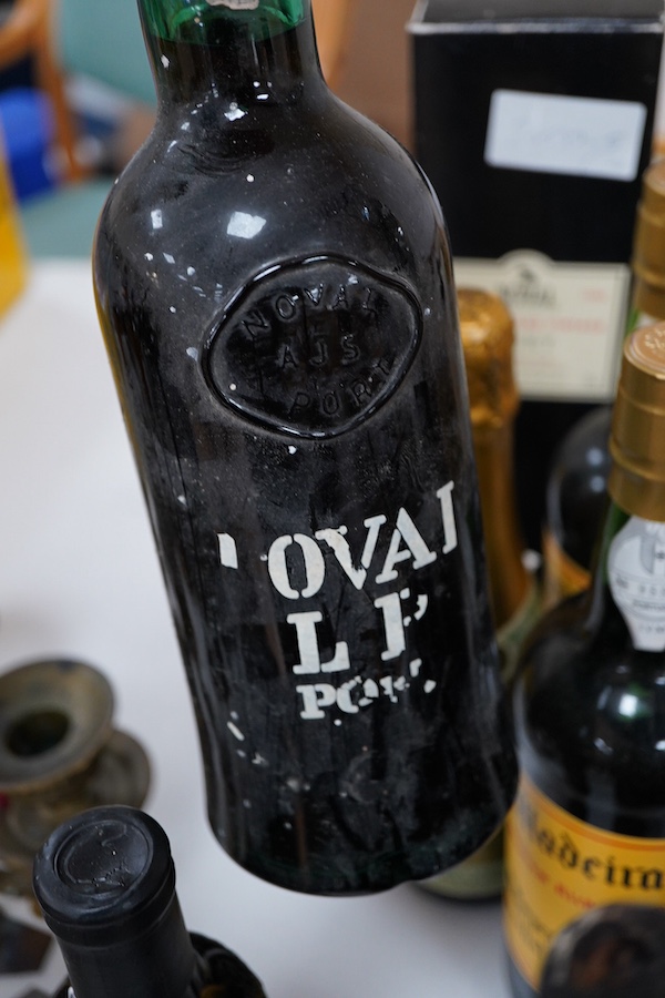 Seven assorted ports including Morgan’s 1985 and three half bottle Fortnum & Mason, together with two Madeira wines and a half bottle of Champagne.